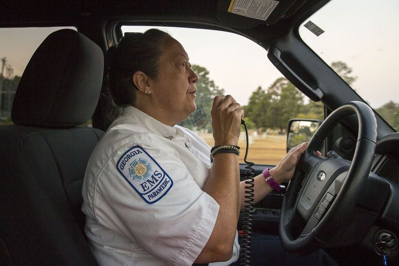 Wilkes County Deputy EMA Director and paramedic Amy Howard radios to a dispatched EMS truck for a location while driving a rapid response vehicle during her morning shift in Washington, Thursday, October 3, 2019. Howard says her “second life” started when she became a paramedic. (Alyssa Pointer/Atlanta Journal Constitution)