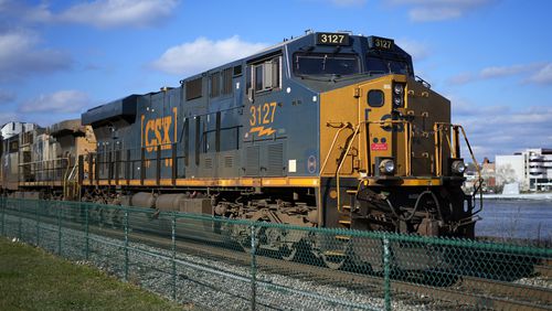 FILE - A CSX freight train sits on a siding in downtown Pittsburgh, Nov. 19, 2022. CSX reports their earnings on Wednesday, April 17, 2024. (AP Photo/Gene J. Puskar, File)