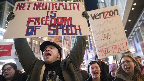 Demonstrators rally in support of net neutrality. AP Photo