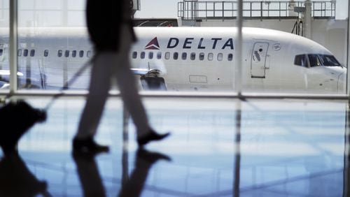 A Delta Air Lines jet at Hartsfield-Jackson International Airport in Atlanta. Delta forecasts a $4.4 billion profit for 2016, down just slightly from the year before. (AP Photo/David Goldman)