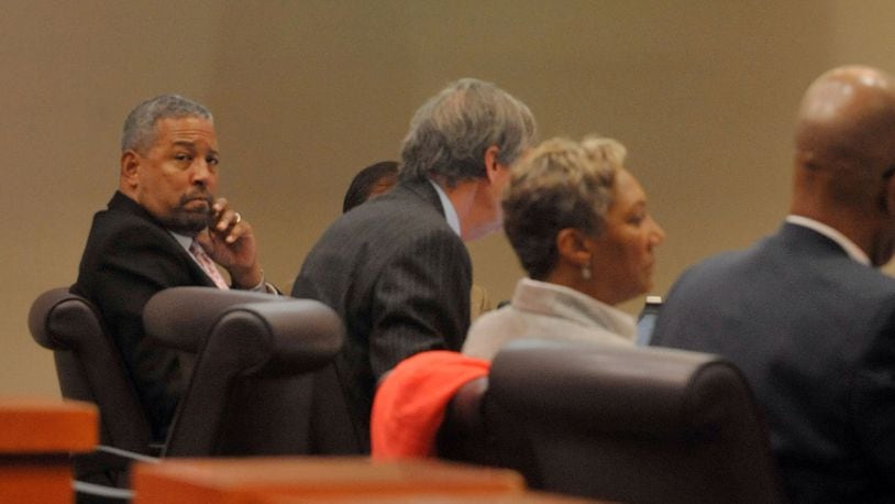 Defendants Tony Pope (left) and Pat Reid (second from right) listen to testimony in court on Wednesday.