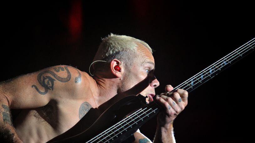 September 21, 2013 Atlanta - Red Hot Chili Peppers bassist Michael Peter Balzary performs during Day 2 of Music Midtown 2013 at Piedmont Park in Atlanta on Saturday, September 21, 2013. HYOSUB SHIN / HSHIN@AJC.COM