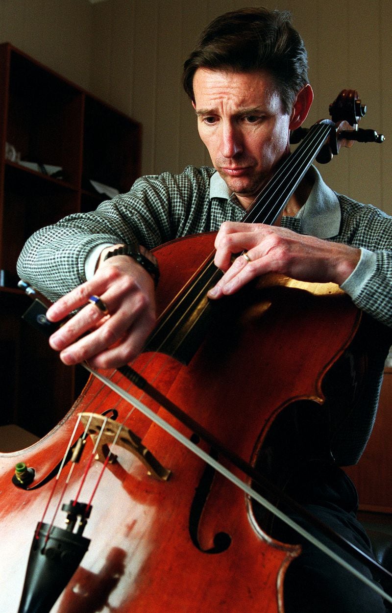 Christopher Rex, ASO's principal cello, practices at home December 29, 1999. (PHIL SKINNER /AJC staff)