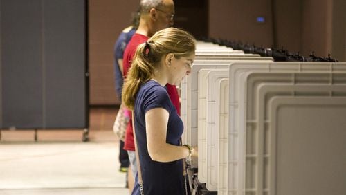 Cobb County residents take part in the primary election voting at Noonday Baptist Church in Marietta, Georgia, on Tuesday, May 22, 2018. (REANN HUBER/REANN.HUBER@AJC.COM)