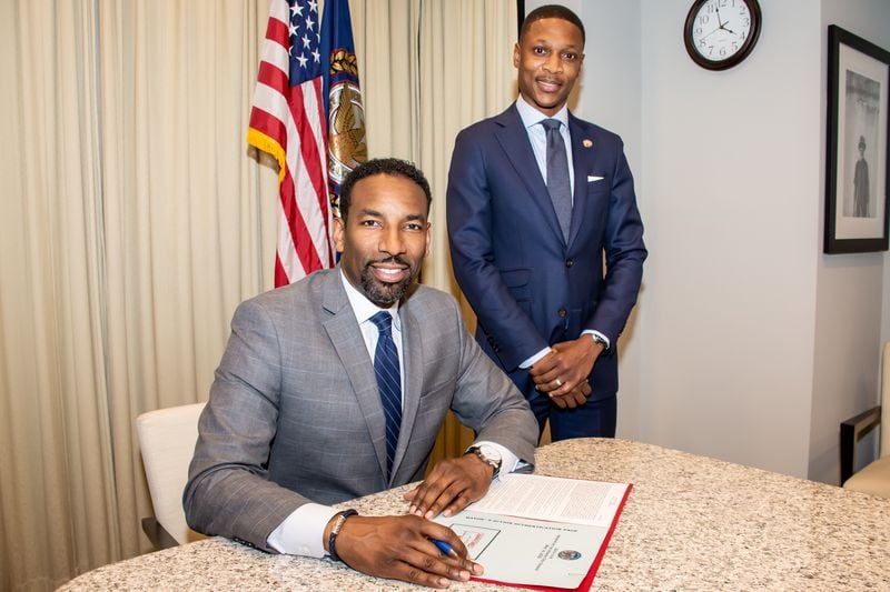 Mayor Andre Dickens signs legislation sponsored by Councilmember Jason Winston to allocate $1.5 million to immediately support the relocation of Forest Cove Apartments residents to new housing. (City of Atlanta)