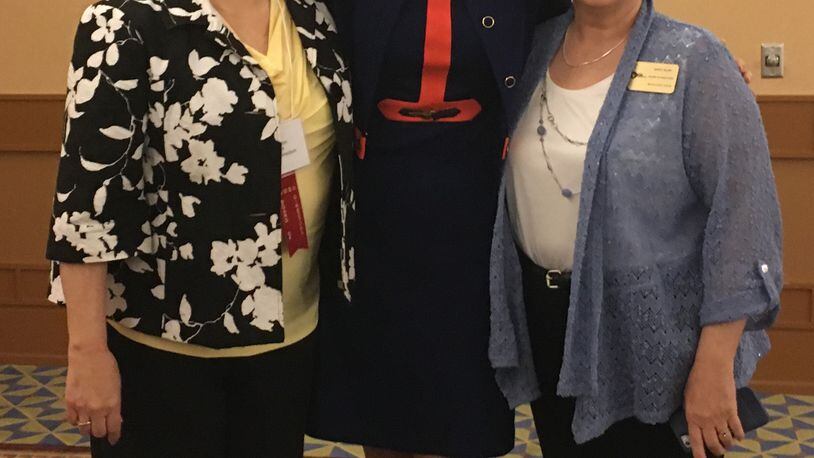 Christy Todd, the Georgia Middle School Association’s 2016 Educator of the Year, center, with former Rising Starr Middle principal Len Patton, left, and current principal Nancy Blair.
