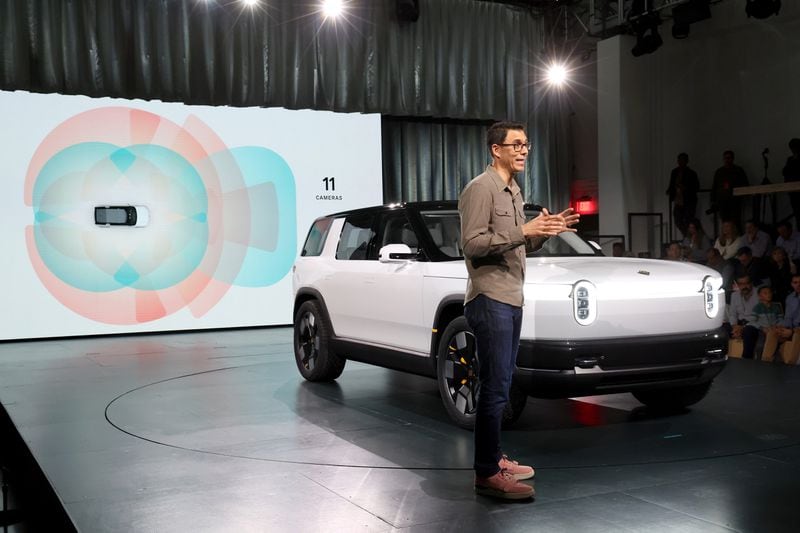 Founder and CEO of Rivian RJ Scaringe speaks onstage during the Rivian Reveals All-Electric R2 Midsize SUV event at Rivian South Coast Theater on March 07, 2024, in Laguna Beach, California. (Photo by Phillip Faraone/Getty Images for Rivian)
