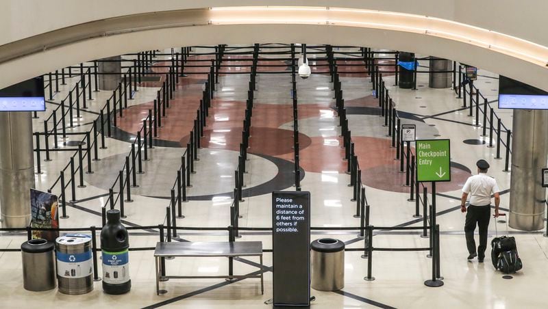 A nearly empty Hartsfield-Jackson International Airport on Thursday April 9, 2020. The AJC’s analysis found that passenger volume had begun to decline in early March even as the number of flights remained constant with the prior year.  (JOHN SPINK/JSPINK@AJC.COM)