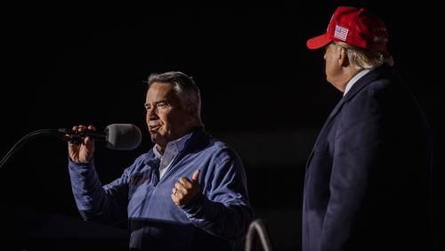 Rep. Jody Hice (R-Ga.) campaigns in Georgia’s Secretary of State Republican primary as Donald Trump looks on, at a  rally in Commerce, Ga., March 26, 2022. The midterms may well affect the fate of free and fair elections in the country. Hice has falsely argued that rampant voter fraud marred the 2020 Georgia election and said he would not have certified Joe Biden’s victory there. (Audra Melton/The New York Times)..