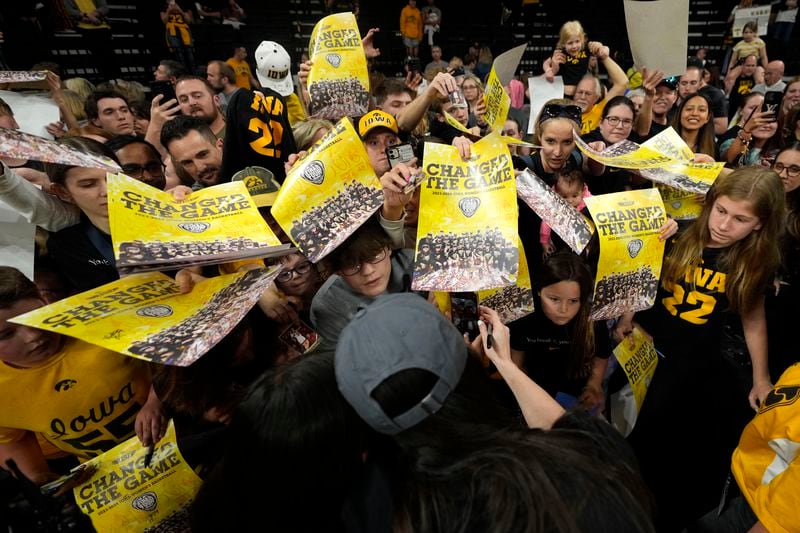 Iowa guard Caitlin Clark signs autographs during an Iowa women's basketball team celebration Wednesday, April 10, 2024, in Iowa City, Iowa. Iowa lost to South Carolina in the championship game of the women's NCAA Tournament on Sunday. (AP Photo/Charlie Neibergall)