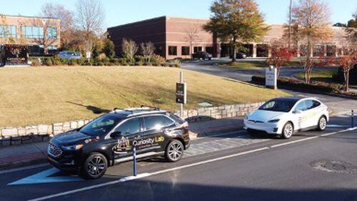 Peachtree Corners recently unveiled the city’s new solar roadway system which produces energy for a solar-powered electronic vehicle charging station located at City Hall, 310 Technology Parkway. (Courtesy City of Peachtree Corners)