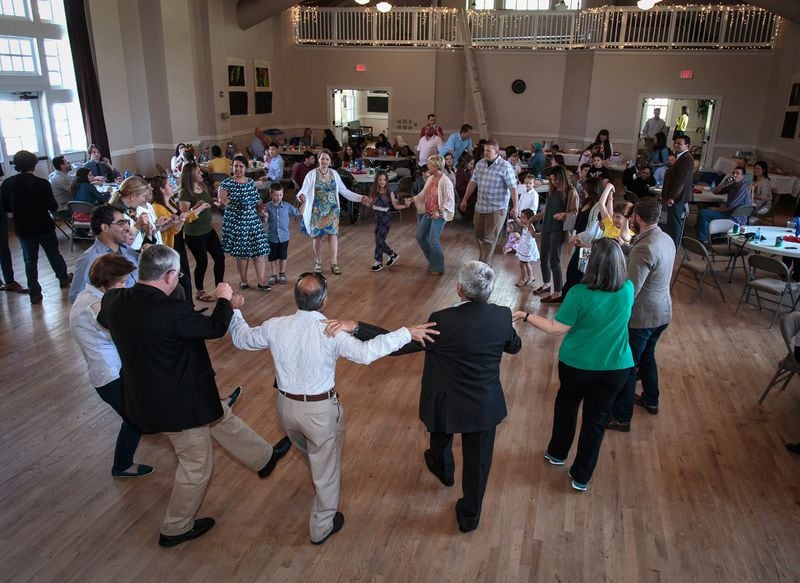The crowd participates in traditional Kurdish music and dance during a luncheon organized by local American military veterans and Atlanta-area Syrian refugees Sunday in Clarkston, GA April 9, 2017. STEVE SCHAEFER / SPECIAL TO THE AJC