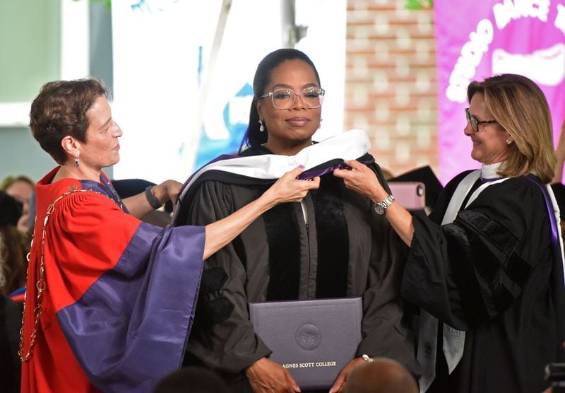 President Elizabeth Kiss of Agnes Scott College  (left) bestowed an honorary degree on Oprah Winfrey ), President, and along iwht Elizabeth Holder, Chair of the Board of Trustees, during Agnes Scott College’s 128th graduation ceremony on Saturday, May 13, 2017. HYOSUB SHIN / HSHIN@AJC.COM