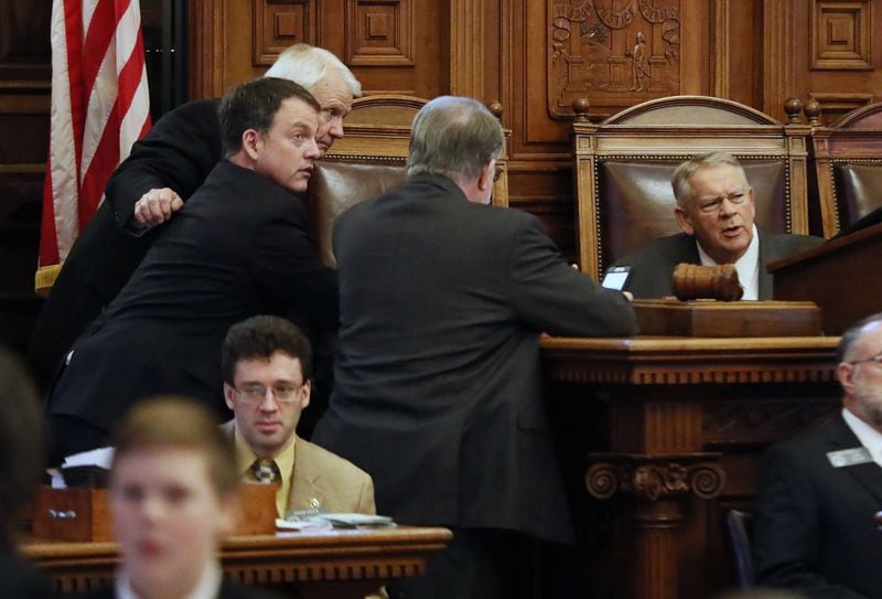 State House Majority Leader Jon Burns, from left, Minority Leader Robert Trammell, Appropriations Chairman Terry England and Speaker David Ralston confer before the House took a recess during this year’s legislative session. Bob Andres / bandres@ajc.com