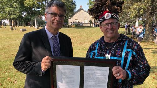 Thomas Kemper, general secretary of the UMC’s General Board of Global Ministries (left), and Billy Friend, chief of the Wyandotte Nation of Oklahoma, display a deed document during an event Saturday, September 21, 2019, marking the return of sacred land to the Native Americans. (Photo: United Methodist Church Global Ministries)
