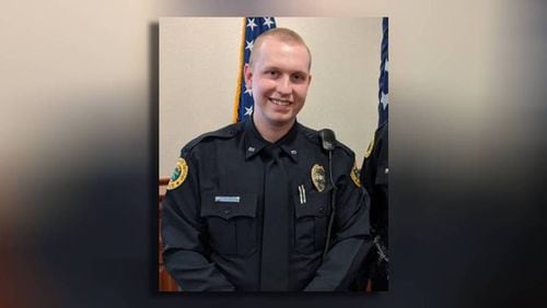 Holly Springs Officer Joe Burson was killed last year while being dragged by a vehicle following a traffic stop. Federal authorities were seeking to apprehend the driver, Ansy Dolce, when the convicted robber fled Burson and another officer, according to Georgia Bureau of Investigation records.