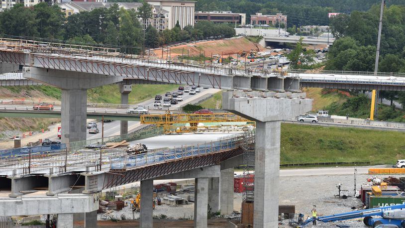 Georgia is receiving a minimum of $8.9 billion for repairs to roads and highways, plus an additional $225 million for bridge replacement and repairs, through the $1.2 trillion infrastructure package President Joe Biden is set to sign into law Monday. (Hyosub Shin / Hyosub.Shin@ajc.com)