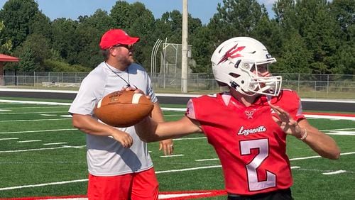 Loganville coach Brad Smith and QB Johnny Crowe have the team off to a 5-0 start.