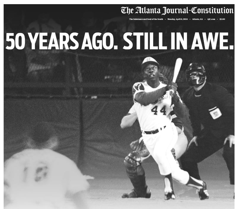 The Monday, April 8, 2024, print edition of The Atlanta Journal-Constitution features a poster that wraps around the front page, marking the 50th anniversary of Hank Aaron's historic home run.
