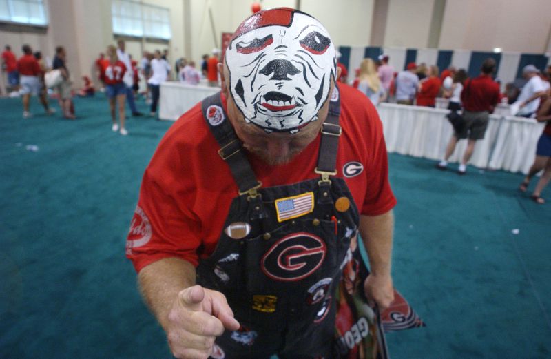 040821 - ATHENS, GA -- Mike 'BIG DAWG' Woods(cq) of Colbert, Georgia shows off his University of Georgia football spirit with a picture of Georgia mascot Uga painted on his scalp during a meet and greet day for Georgia fans to meet the University of Georgia football team at the Classic Center in downtown Athens, Georgia. (BILLY SMITH II/AJC staff)