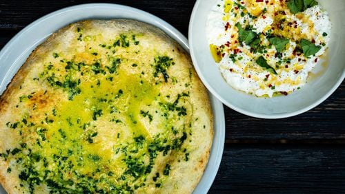 Creamy stracciatella is served with a freshly baked flatbread at No. 246 in Decatur. CONTRIBUTED BY HENRI HOLLIS