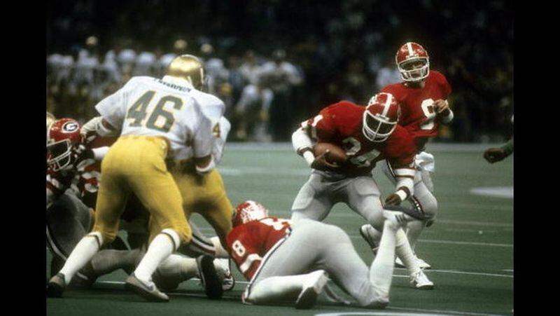 Running back Herschel Walker #34 of the University of Georgia Bull Dogs carries the ball against the Notre Dame Fighting Irish during the Sugar Bowl game January 1, 1981 at the Louisiana Superbowl in New Orleans. Getty Images
