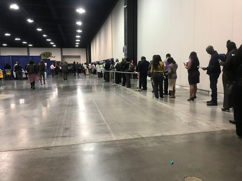 Job seekers line up for the Delta Global Services booth.