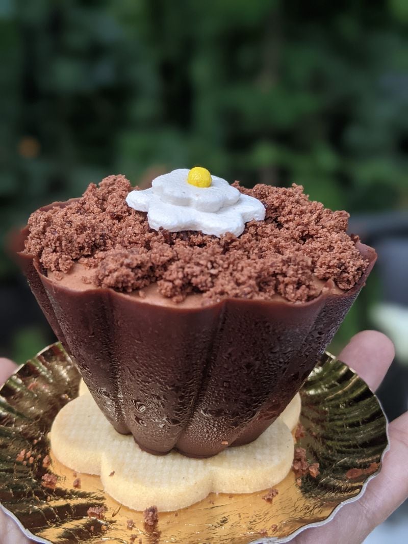 The chocolate flowerpot from Amore Mio features chocolate mousse studded with cherries inside a chocolate shell that rests on a shortbread cookie. Courtesy of Paula Pontes