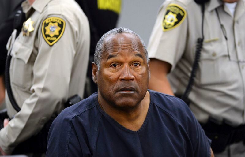 FILE - In this May 14, 2013, file photo, O.J. Simpson sits during a break on the second day of an evidentiary hearing in Clark County District Court in Las Vegas. Simpson, the decorated football superstar and Hollywood actor who was acquitted of charges he killed his former wife and her friend but later found liable in a separate civil trial, has died. He was 76. (AP Photo/Ethan Miller, Pool, File)