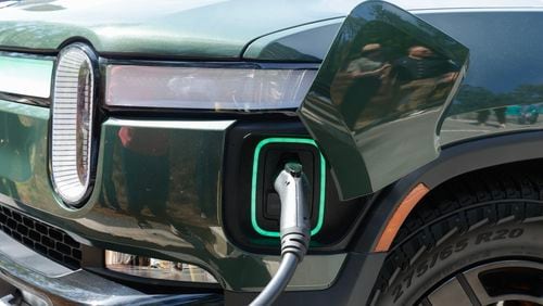 A Rivian EV charger charges a vehicle at Tallulah Gorge State Park on Thursday, April 20, 2023.  (Natrice Miller/natrice.miller@ajc.com)