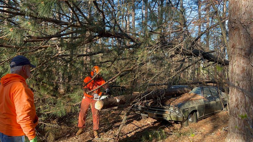 Liberty University students such as Eric Mullikun (with saw) spent their 2023 spring break helping in areas of Georgia hit by tornadoes in January. (Courtesy of Liberty University)