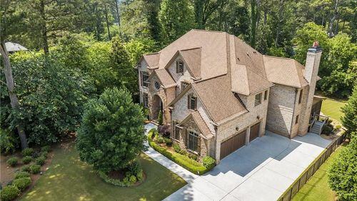 This Decatur home features a private elevator, massive backyard with a pool and spa and a home theatre room — all for a $1.2 million price tag.