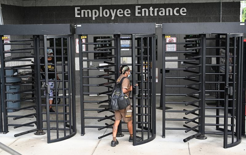 August 4, 2022 Atlanta - UPS employees enter UPS SMART Hub in Atlanta on Thursday, August 4, 2022. The Teamsters were holding a contract rally among workers in preparation for negotiations with UPS coming up over the next year. (Hyosub Shin / Hyosub.Shin@ajc.com)