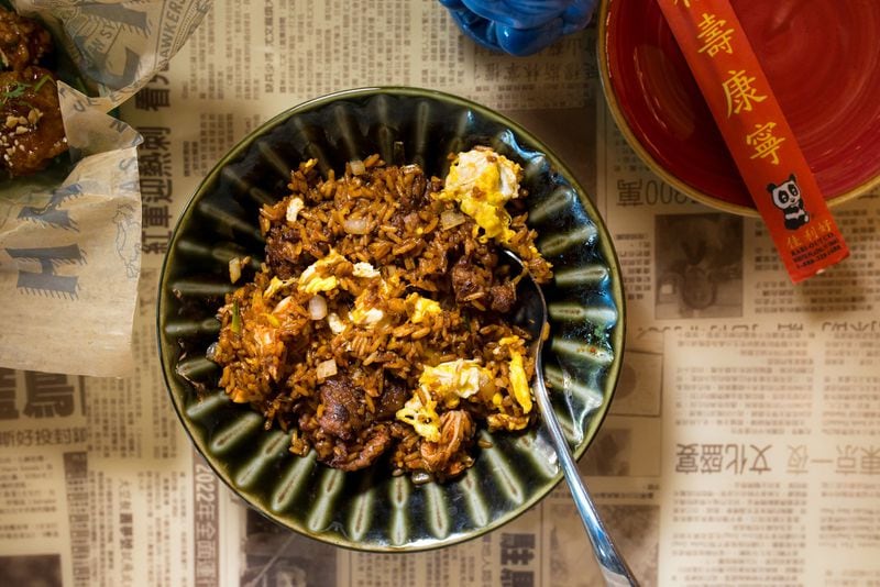 Hawkers Kimchi Fried Rice with sliced steak, eggs, onions, and soy sauce. Photo credit- Mia Yakel