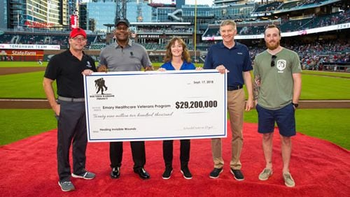 (From left to right) Wounded Warrior Project’s Michael Richardson and Alonzo Smith pictured with Emory Healthcare Veterans Program representatives, retired Lt. Gen.  William “Burke” Garrett, Sheila Rauch and Marine veteran Timothy Banik during the Sept. 17 pregame presentation at the Atlanta Braves’ SunTrust Park.