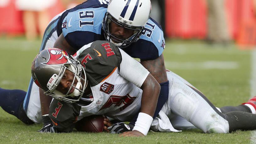 Tampa Bay Buccaneers quarterback Jameis Winston (3 is sacked by Tennessee Titans outside linebacker Derrick Morgan (91) is about to sack him during the second half of an NFL football game, Sunday, Sept. 13, 2015, in Tampa, Fla. The Titans defeated the Bucs 42-14.(AP Photo/Brian Blanco)