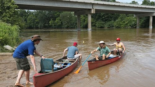 August 21, 2015 - Whitesburg - Jakeb Cook (from left), Michael Hair, Kyle Grantham and Micah Beardon put in their canoes at the Chattahoochee River in Whitesburg.