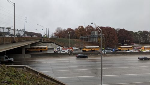 Dec. 8, 2017, Atlanta -- School buses from Rockdale County were at the head of a column of stopped automobiles along eastbound Interstate 20 near the Moreland Avenue exit late Friday morning.