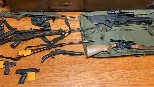 Guns recovered by the Cherokee County Sheriff's Office after a drug bust at a  Woodstock home Friday morning led to the arrest of all seven residents.