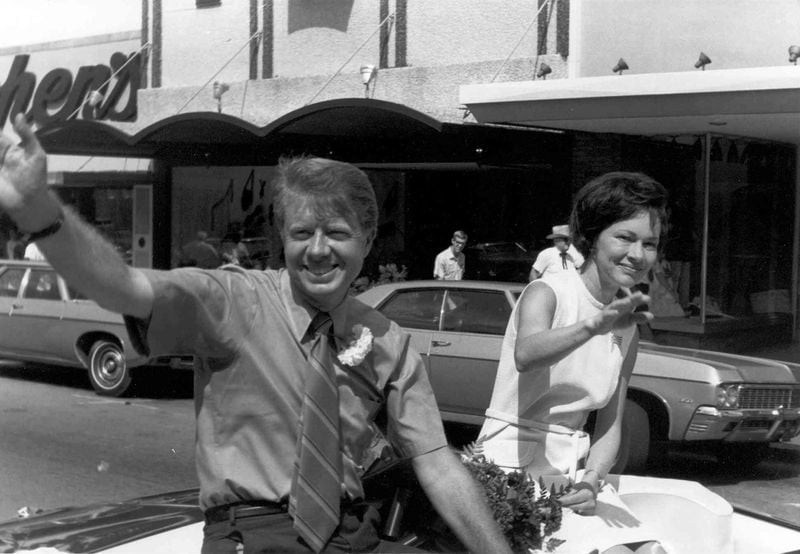 In this undated photo, Jimmy and Rosalynn sit on the back of a car in a parade; campaigning. (Carter family photo / Jimmy Carter Library)