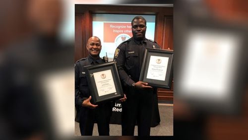 MARTA Officer Keith Softley (left) and Corporal Michael Woodward were awarded by the American Red Cross for saving a man's life at Kensington MARTA station.