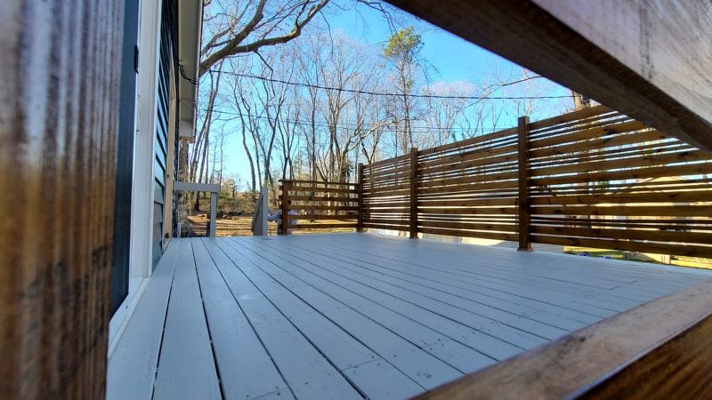 A Genesis Contracting of GA deck staining project in progress. Genesis owner Jose Padilla recommends homeowners stay on top of maintenance projects like these to prevent bigger issues from developing.
