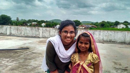 Sravya Ambadipudi, a senior at Northview High School in Johns Creek, spent two weeks this summer in a rural village in India. She taught English to Naishita and other young children. CONTRIBUTED