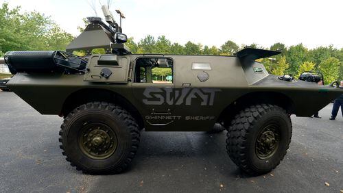 Gwinnett Sheriff Department's SWAT Light Armored Vehicle (or LAV for short) at the Gwinnett County Jail in Lawrenceville in 2014. The Obama administration halted the transfer of certain military surplus items to local law enforcement agencies in 2015, but these restrictions were lifted by President Trump in 2017. (KENT D. JOHNSON / AJC file)