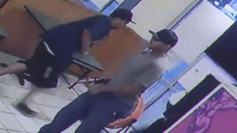 Surveillance video shows an armed man casually walk into the Lucky Panda Chinese restaurant and shoot a man to death. (Credit: Channel 2 Action News)