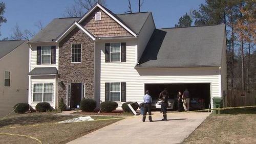 A man was found shot to death in the garage of this house in south Fulton County.