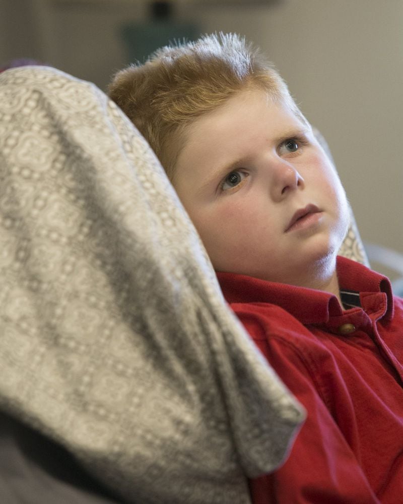Tripp Halstead is unable to walk or talk, but he’s begun to show emotions. (CASEY SYKES, CASEY.SYKES@AJC.COM)