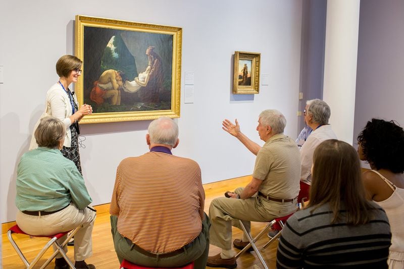 Amanda Williams, an artist and art educator at the High Museum of Art, leads a “Musing Together” art tour designed for people in the early stages of dementia and their care partners. “We just want them to come and enjoy themselves,” Williams said.  