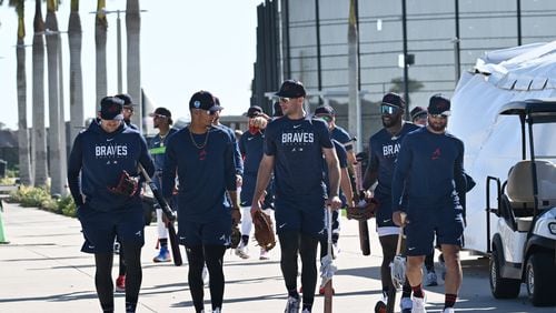 Atlanta Braves players walk to the stadium for their batting practice during Braves spring training at CoolToday Park, Thursday, Feb. 16, 2023, in North Port, Fla.. (Hyosub Shin / Hyosub.Shin@ajc.com)
