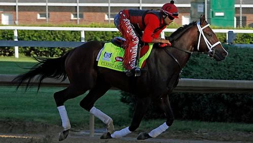 Classic Empire, ridden by exercise rider Martin Rivera, gallops at Churchill Downs in Louisville, Ky., Tuesday, May 2, 2017.  (AP Photo/Garry Jones)